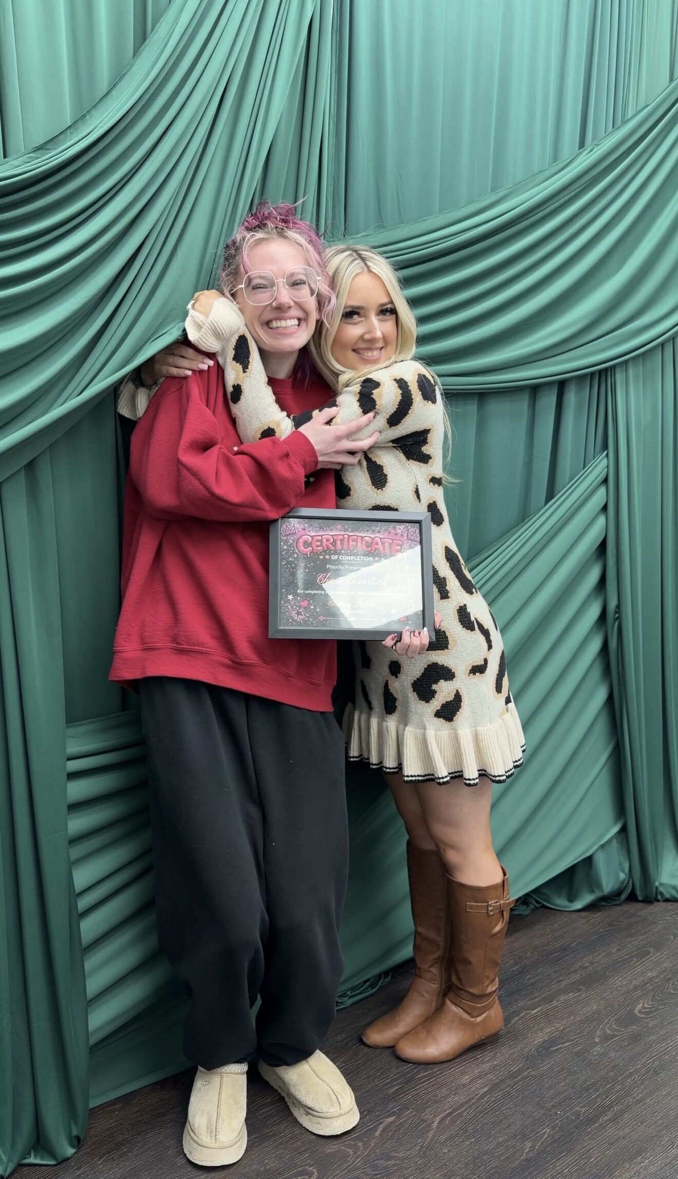 Cortney hugging a student after class